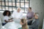 A work team sitting around a table